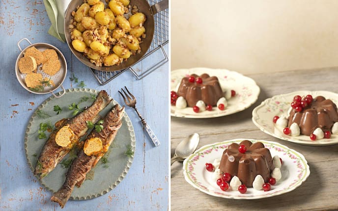 Gebratene Fische, Kräuterbutter, Pfannenerdäpfel, daneben Schokopudding mit Preiselbeeren und Schlagobertupfer