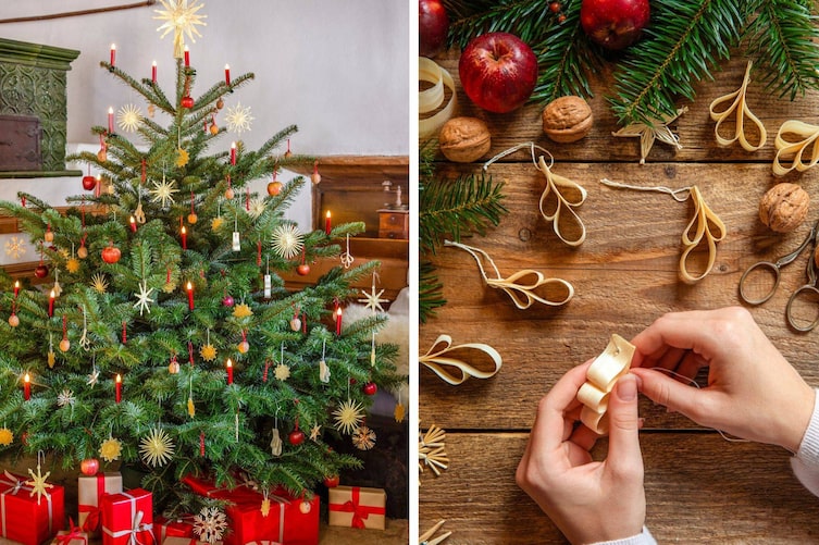 Traditioneller Christbaum mit Strohsternen und Wachssternen, rote Kerzen. Hände, die Anhänger basteln.