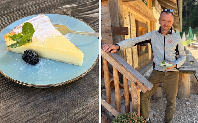 Ein Teller mit einem Stück Käsekuchen und Hüttenwirt Peter Flatscher.